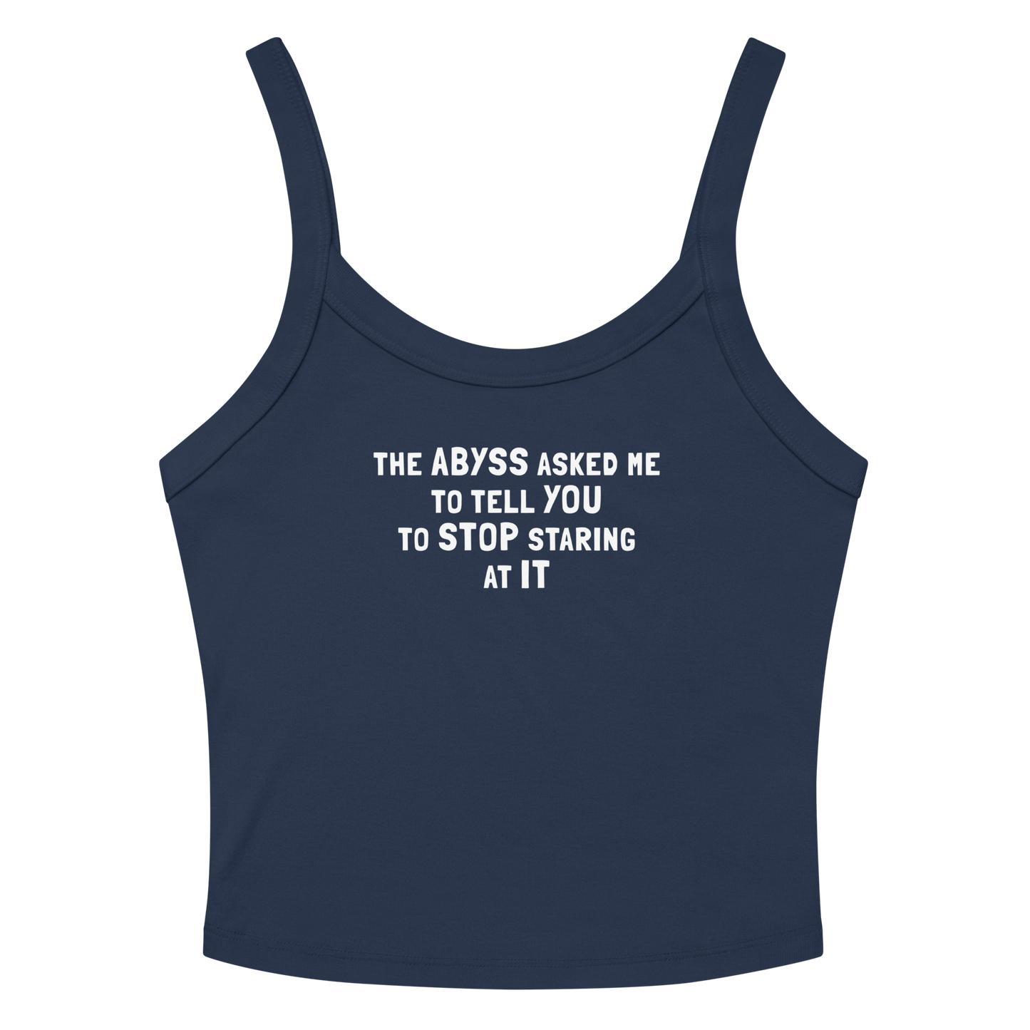 "The Abyss asked me to tell you to stop staring at it" printed on a solid navy blend women's micro-rib tanktop laying on a flat surface amongst sunglasses and shorts
