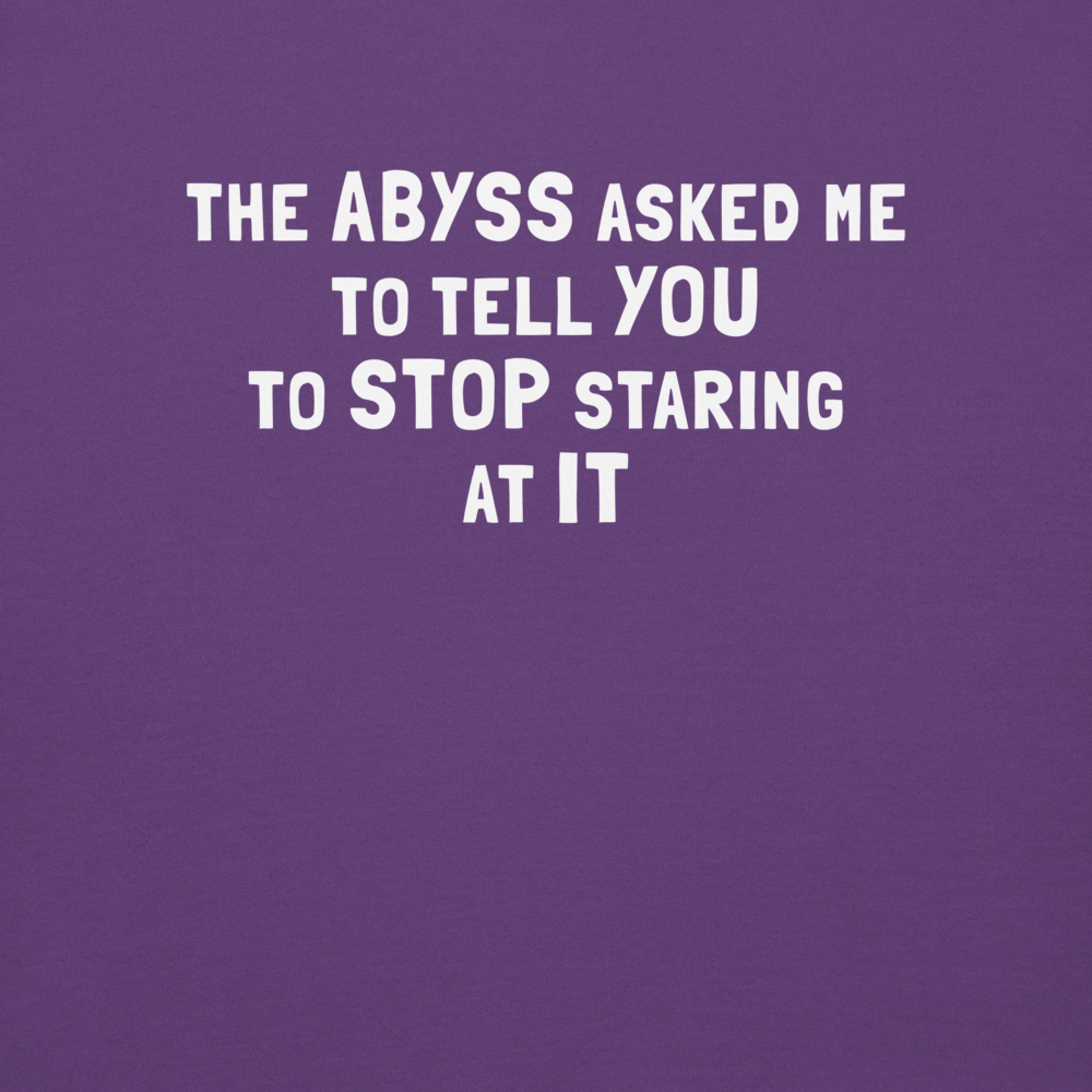 "The Abyss asked me to tell you to stop staring at it" printed on a purple background