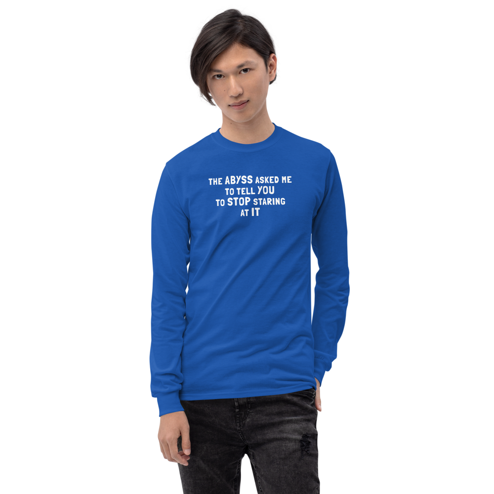 "The Abyss asked me to tell you to stop staring at it" printed on a royal men's long sleeve shirt worn by a male