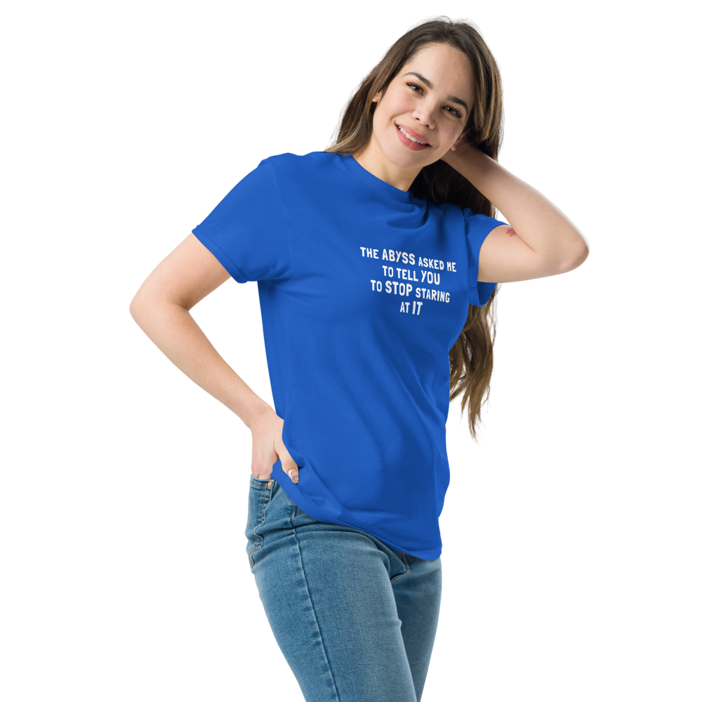 "The Abyss asked me to tell you to stop staring at it" printed on a royal unisex classic tee worn by a female