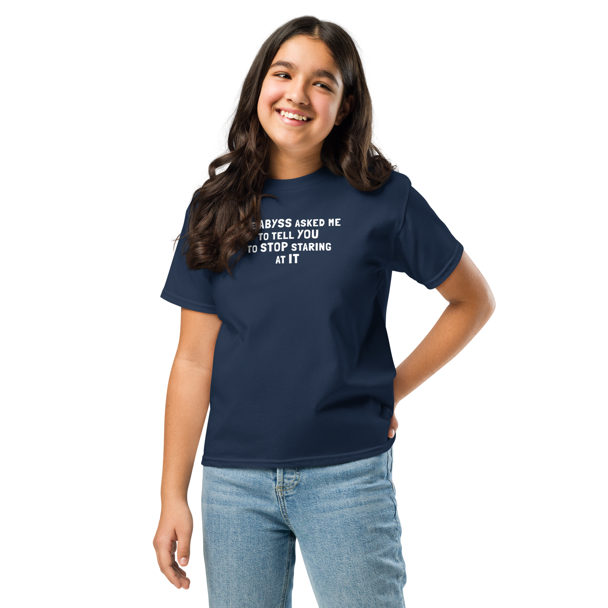 "The Abyss asked me to tell you to stop staring at it" printed on a navy youth classic tee worn by a female