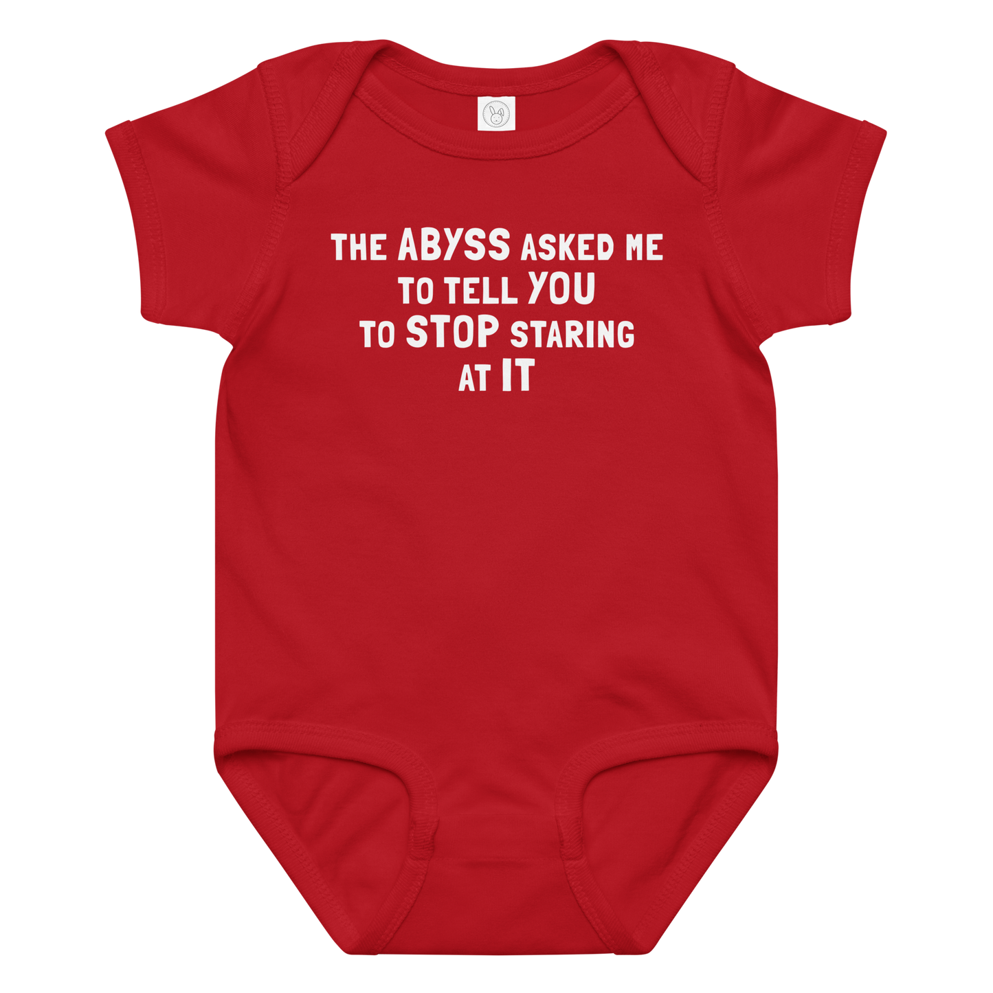 "The Abyss asked me to tell you to stop staring at it" printed on a red baby jersey bodysuit laying on a flat surface amongst other clothes