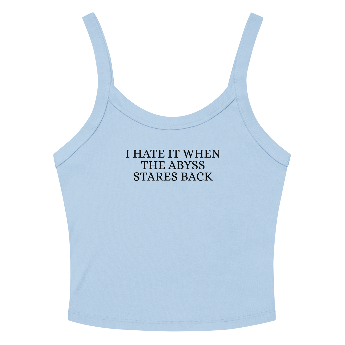 "I hate it when the abyss stares back" printed on a solid baby blue blend women's micro-rib tanktop laying on a flat surface amongst sunglasses and shorts