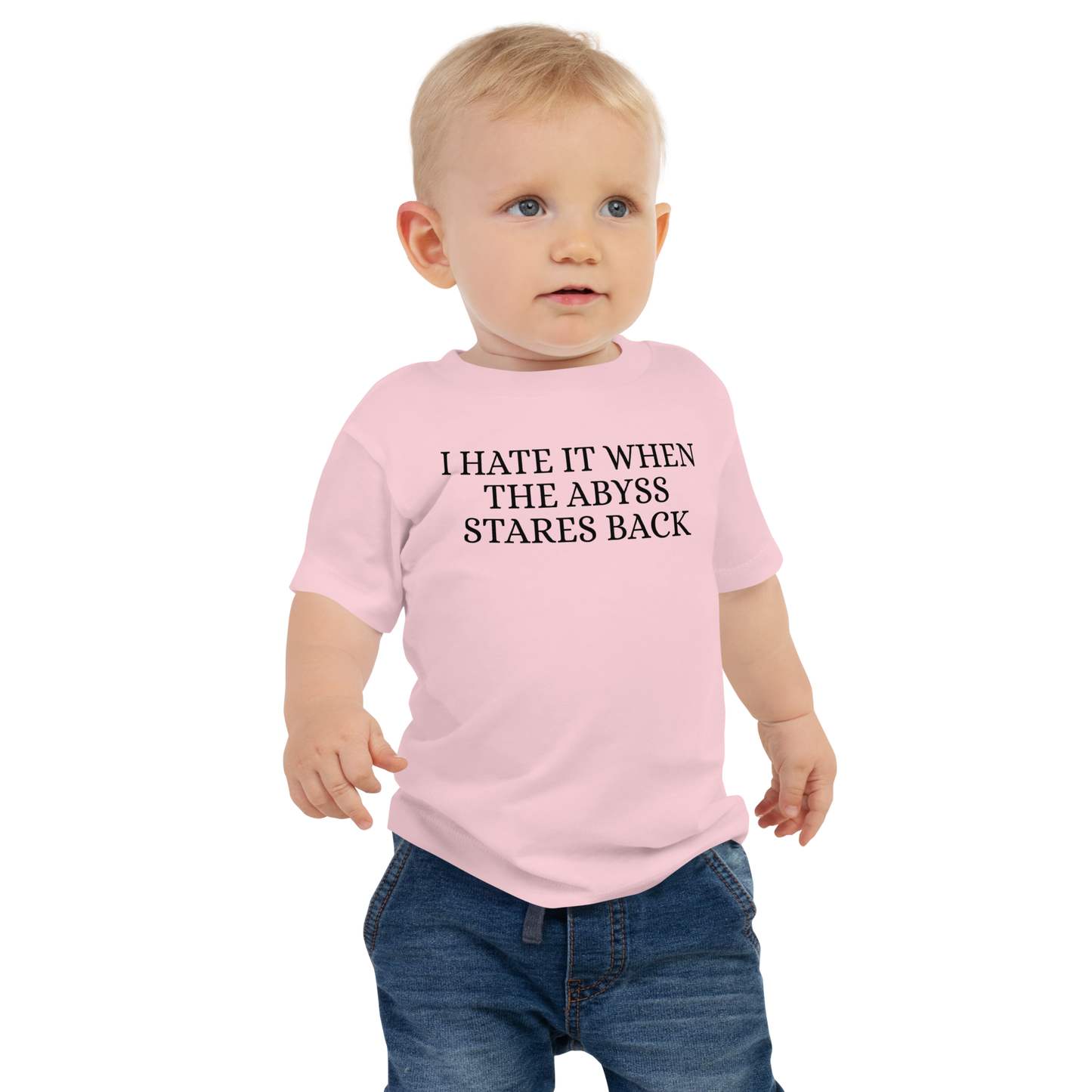 "I hate it when the abyss stares back" printed on a pink baby jersey short sleeve tee worn by a male