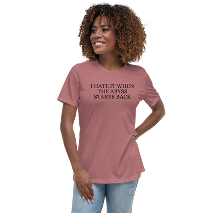 "I hate it when the abyss stares back" printed on a heather mauve women's relaxed t-shirt worn by a female
