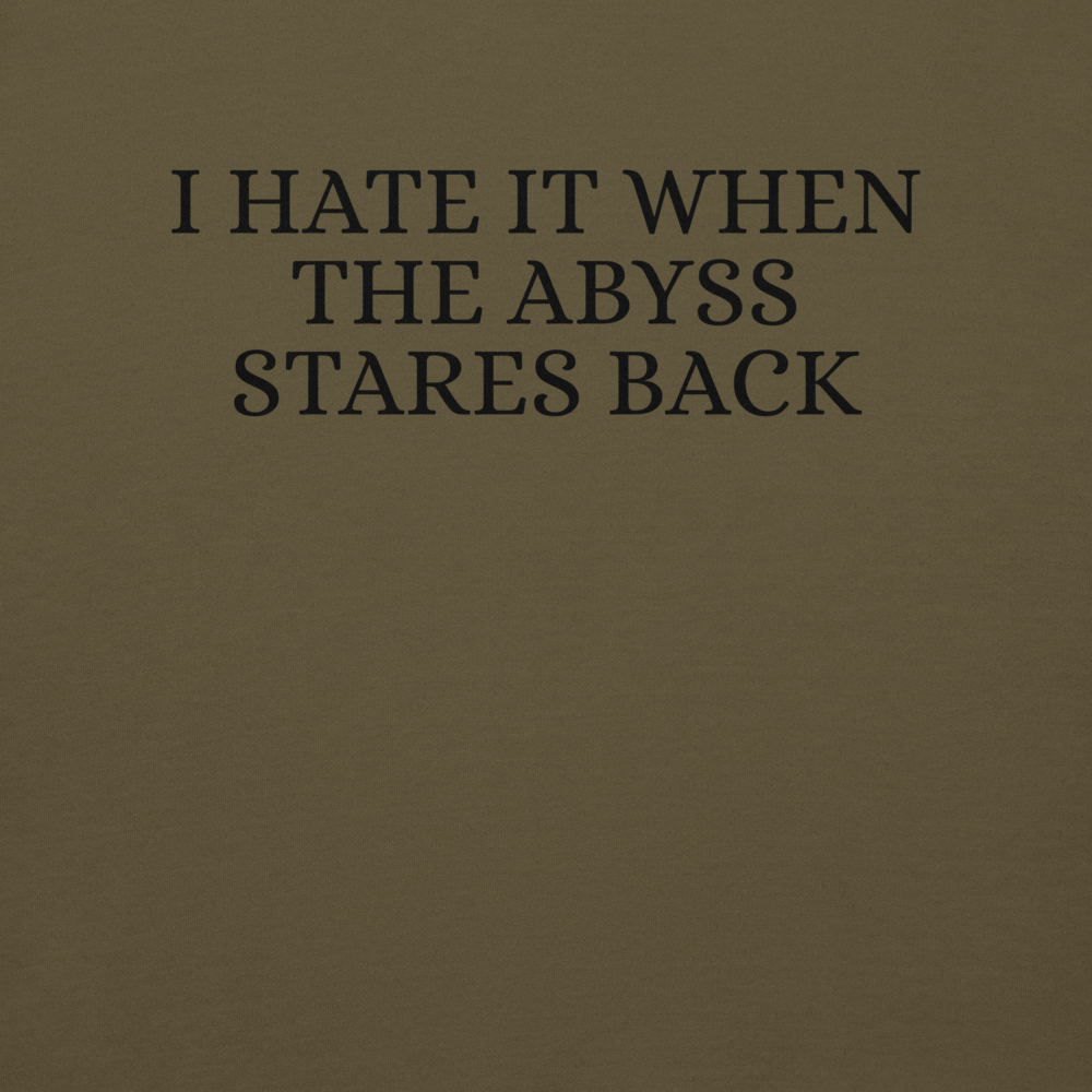 "I hate it when the abyss stares back" printed on a military green background