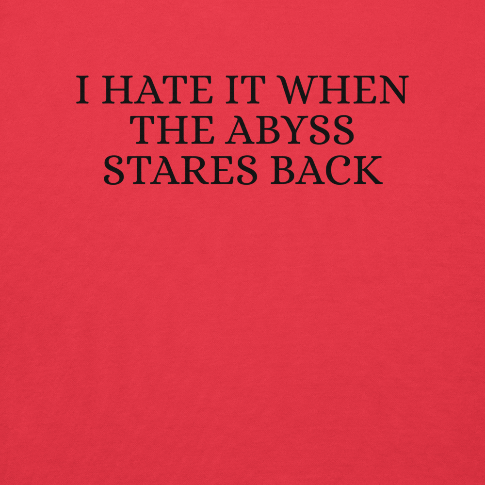 "I hate it when the abyss stares back" printed on a team red background