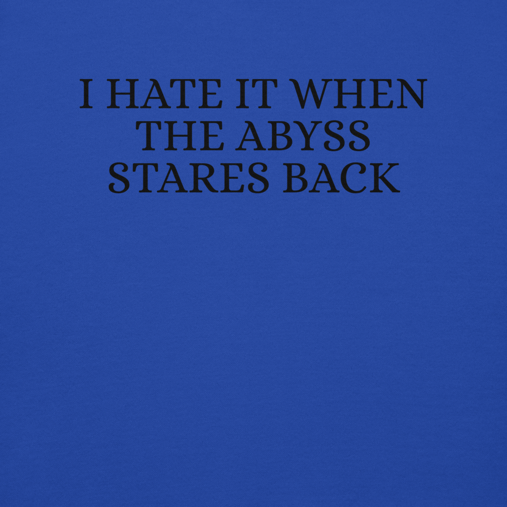 "I hate it when the abyss stares back" printed on a team royal background