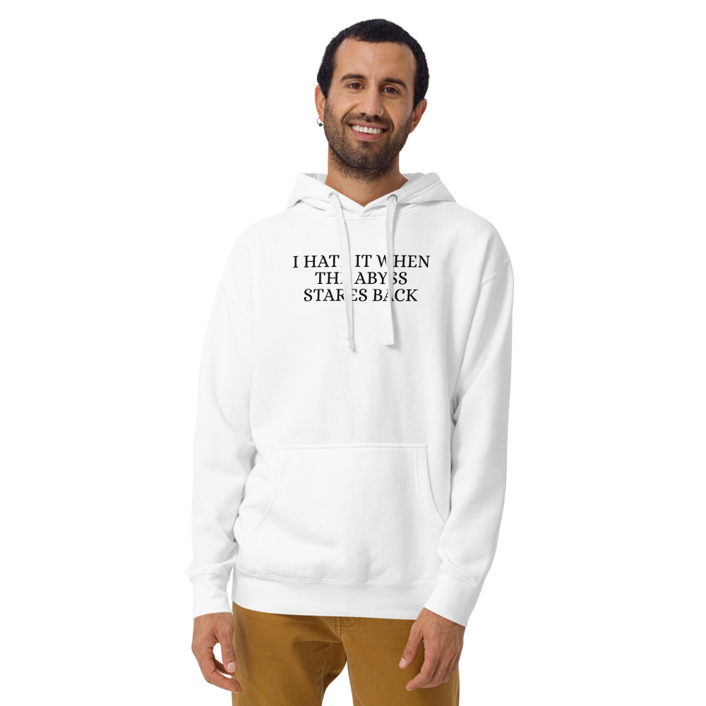 "I hate it when the abyss stares back" printed on a white warn by a male