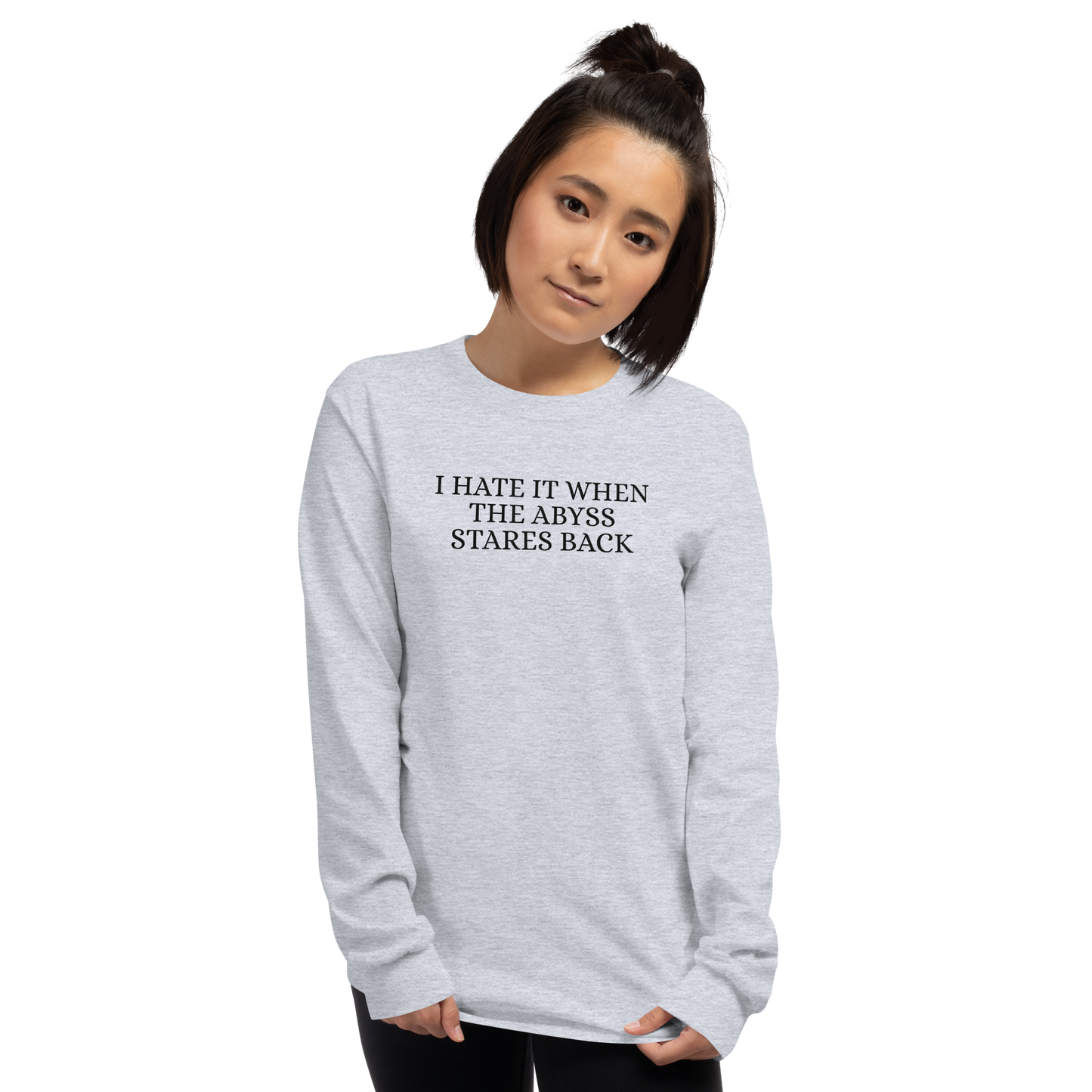 "I hate it when the abyss stares back" printed on a sport grey men's long sleeve shirt worn by a female