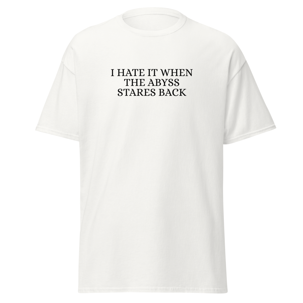 "I hate it when the abyss stares back" printed on a white on an invisible body