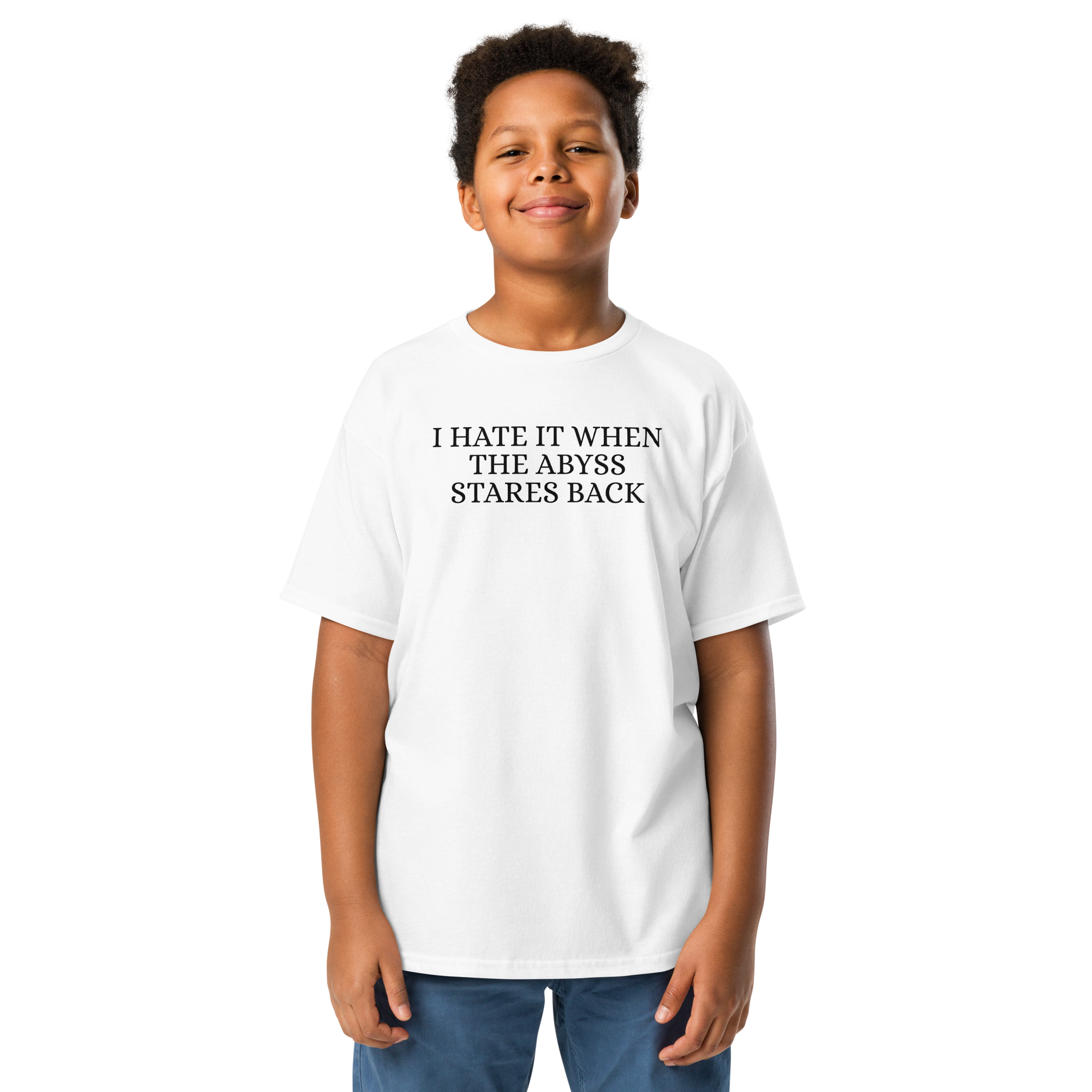"I hate it when the abyss stares back" printed on a white youth classic tee worn by a male