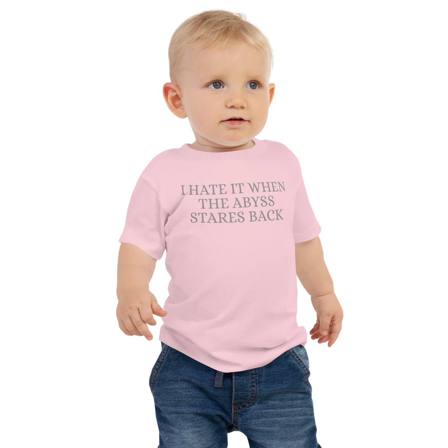"I hate it when the abyss stares back" printed on a pink baby jersey short sleeve tee worn by a male