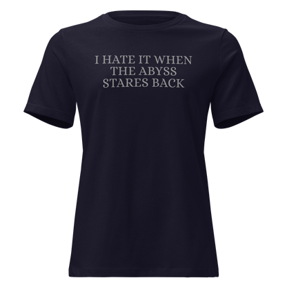 "I hate it when the abyss stares back" printed on a navy on an invisible / simulated body
