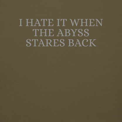 "I hate it when the abyss stares back" printed on a military green background