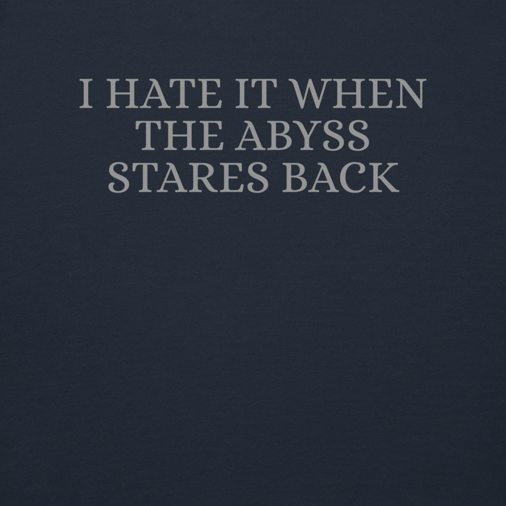 "I hate it when the abyss stares back" printed on a navy blazer background