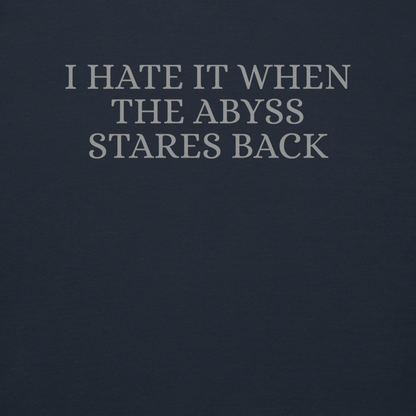 "I hate it when the abyss stares back" printed on a navy blazer background