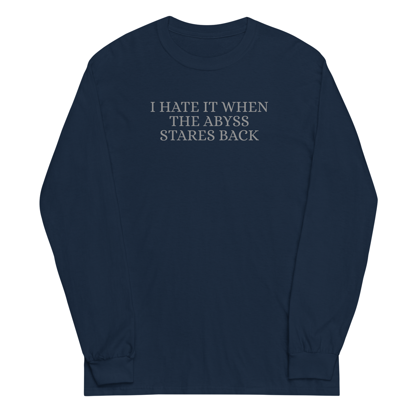 "I hate it when the abyss stares back" printed on a navy men's long sleeve shirt laying on a flat surface
