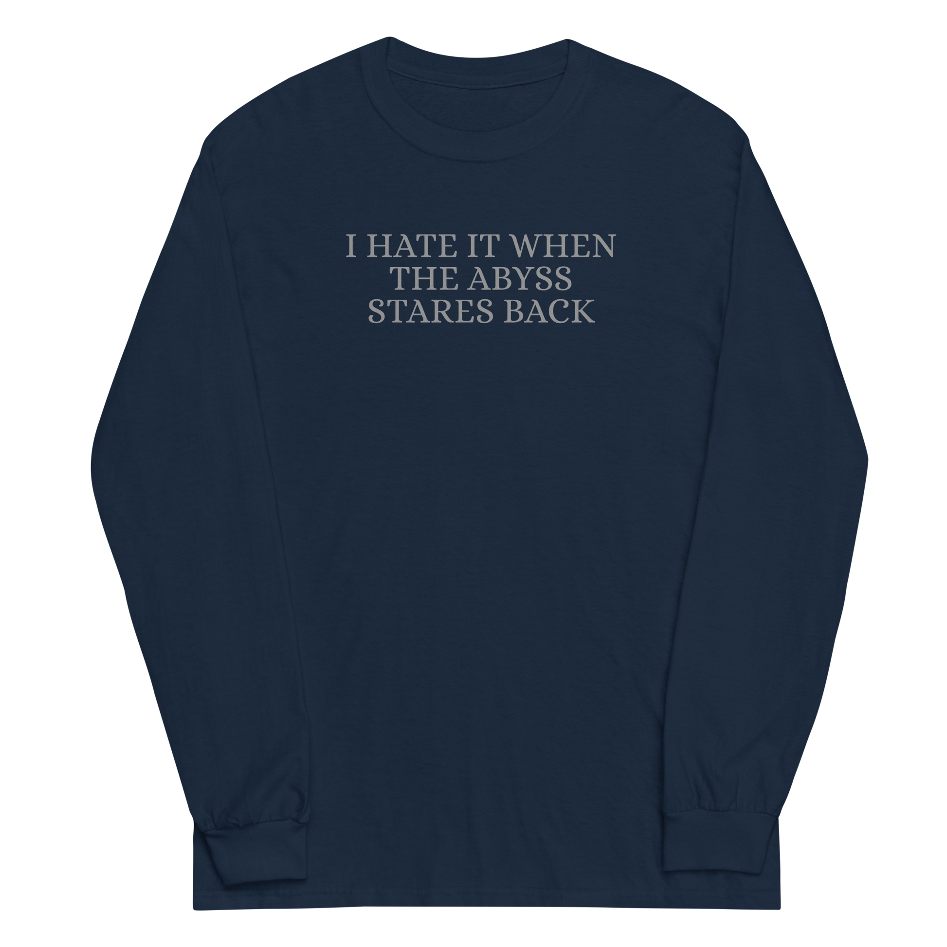"I hate it when the abyss stares back" printed on a navy men's long sleeve shirt laying on a flat surface
