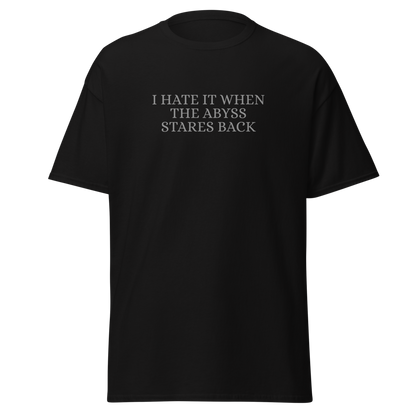 "I hate it when the abyss stares back" printed on a black on an invisible body