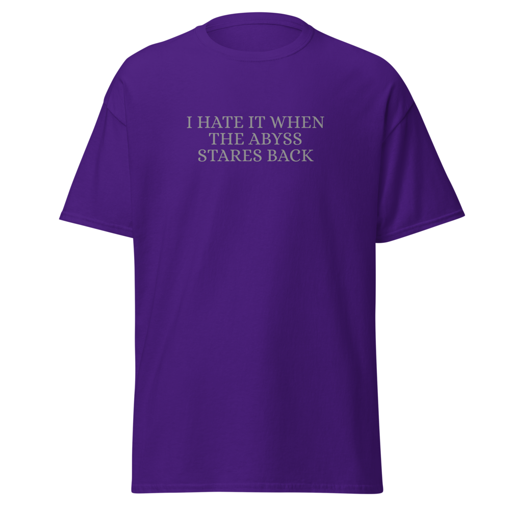 "I hate it when the abyss stares back" printed on a purple on an invisible body