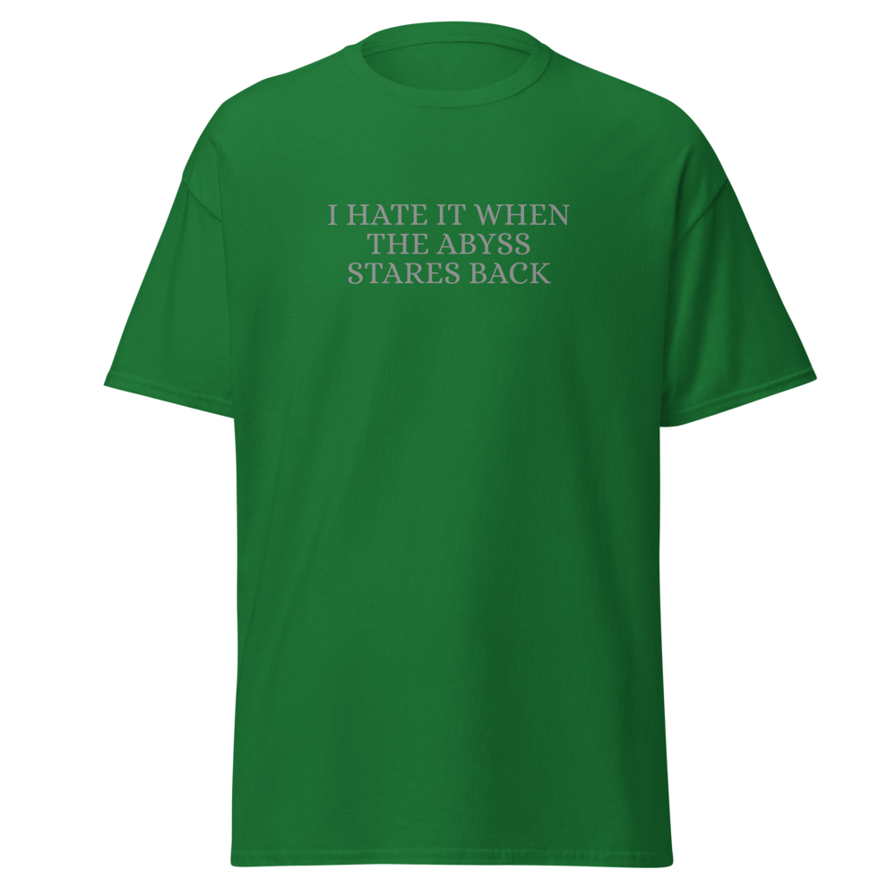 "I hate it when the abyss stares back" printed on a turf green on an invisible body