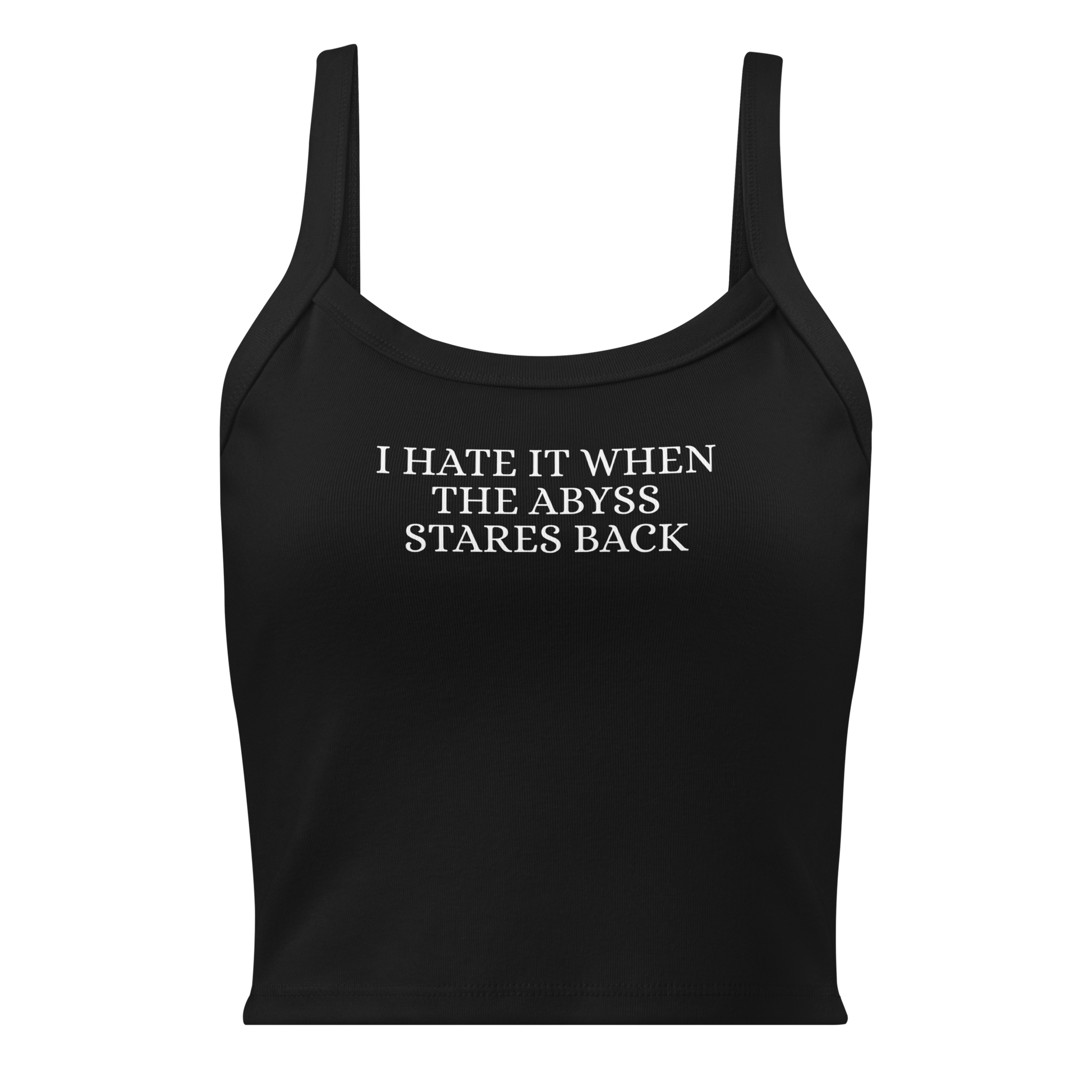 "I hate it when the abyss stares back" printed on a solid black blend women's micro-rib tanktop laying on a flat surface