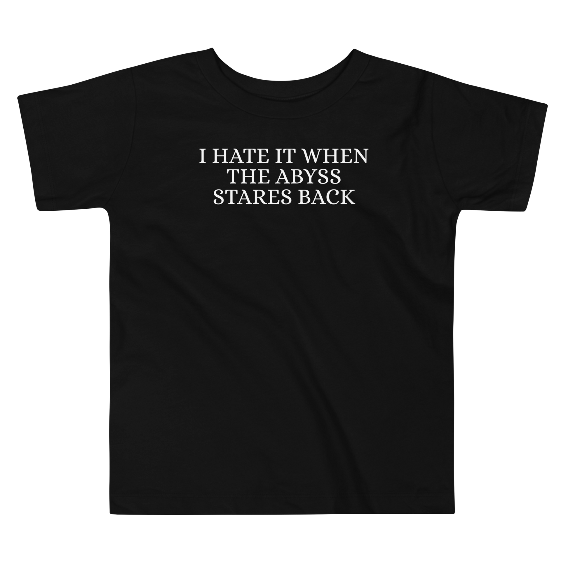 "I hate it when the abyss stares back" printed on a black toddler short sleeve tee laying on a flat surface