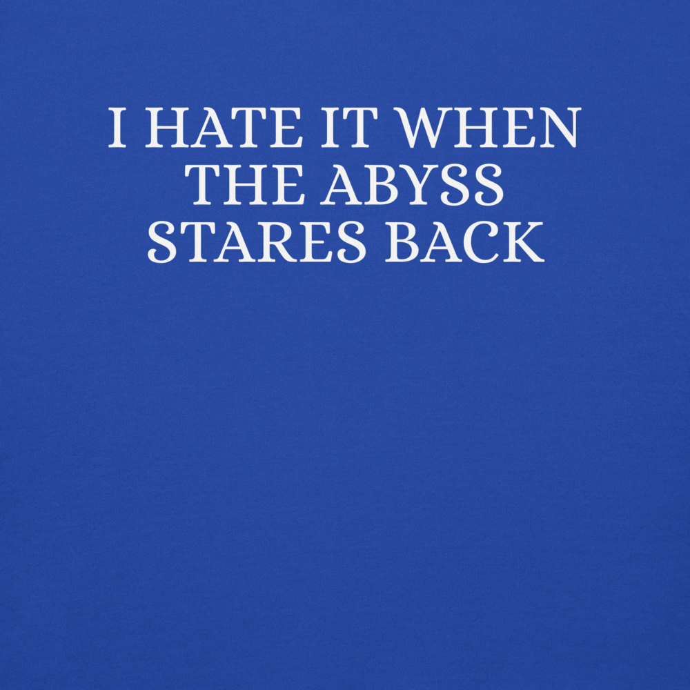 "I hate it when the abyss stares back" printed on a team royal background