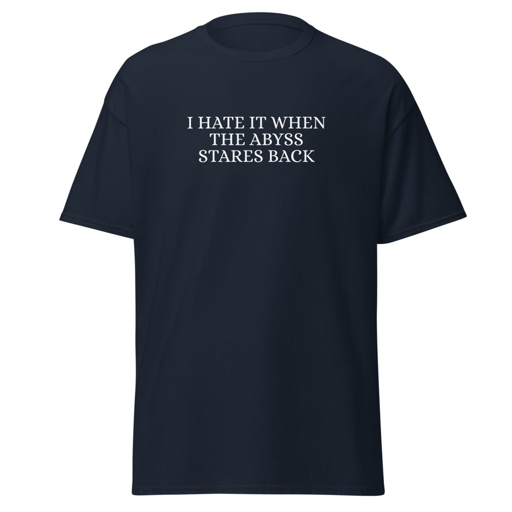 "I hate it when the abyss stares back" printed on a navy on an invisible body