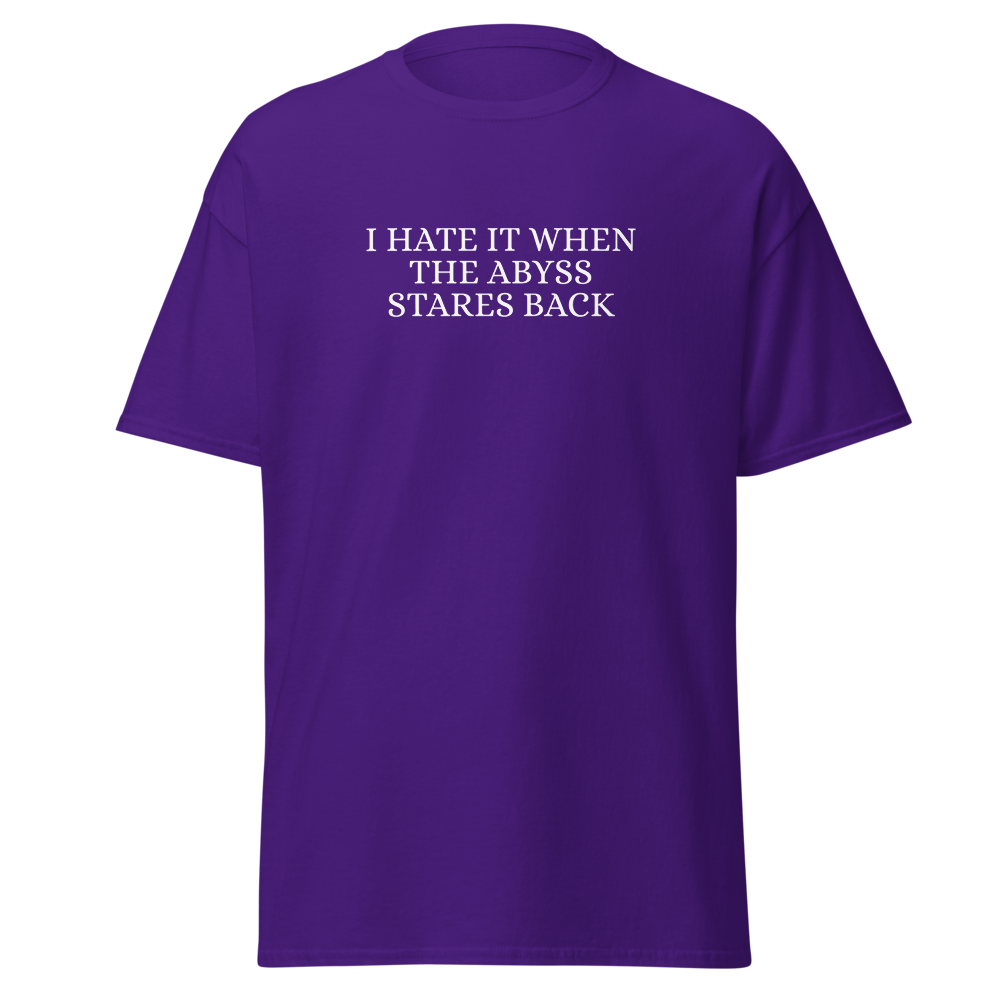 "I hate it when the abyss stares back" printed on a purple on an invisible body