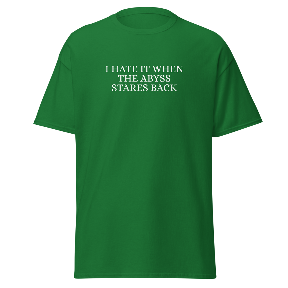 "I hate it when the abyss stares back" printed on a turf green on an invisible body