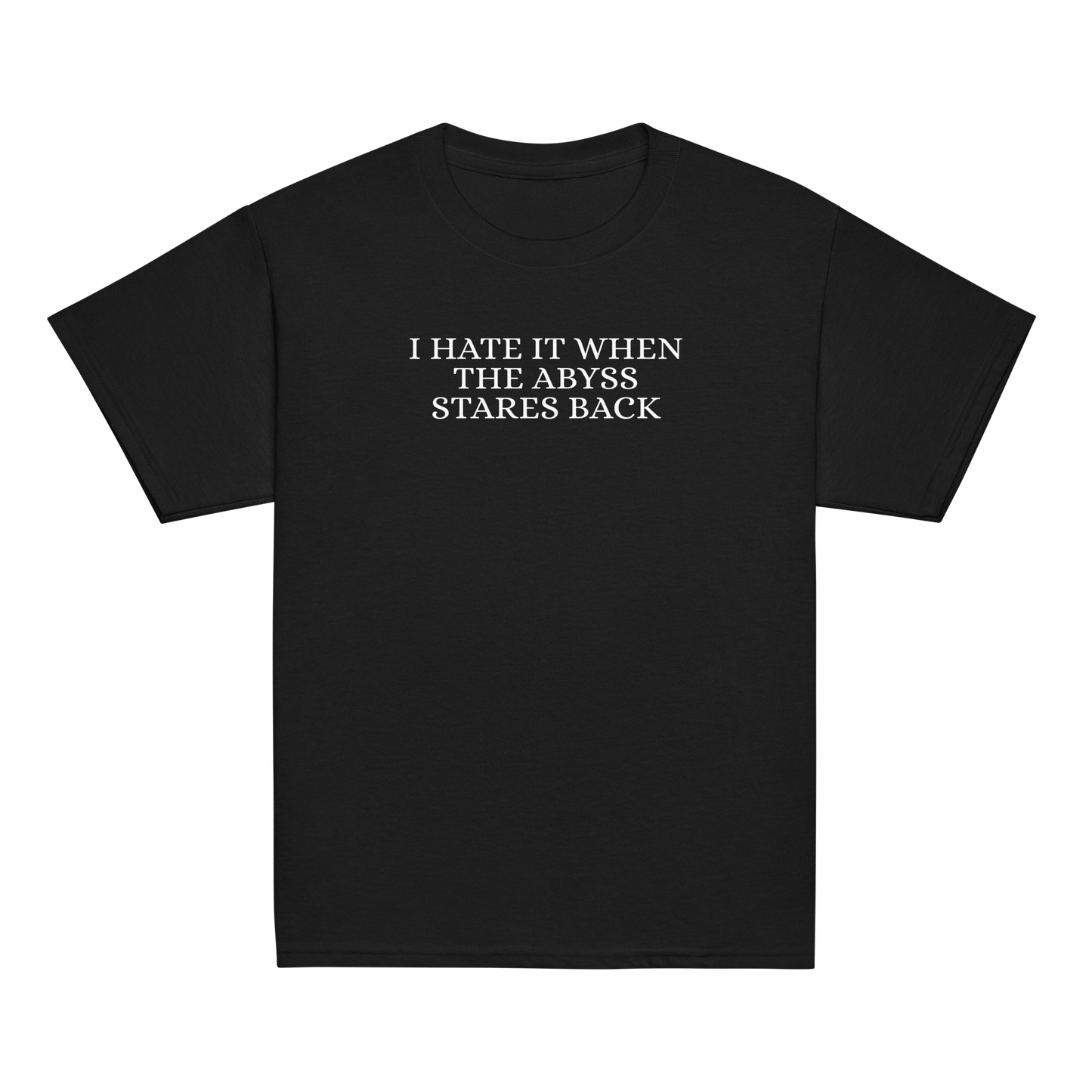 "I hate it when the abyss stares back" printed on a black youth classic tee laying on a flat surface