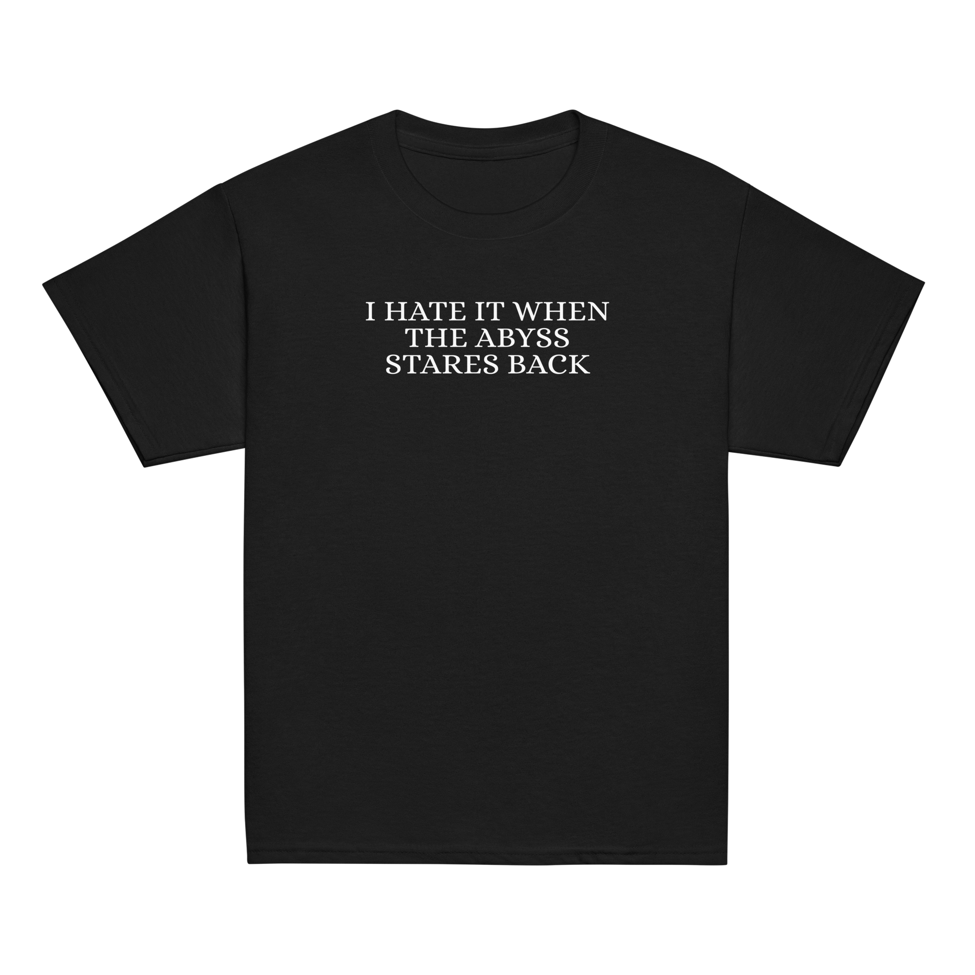 "I hate it when the abyss stares back" printed on a black youth classic tee laying on a flat surface