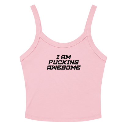 "I Am Fucking Awesome" printed on a solid pink blend women's micro-rib tanktop laying on a flat surface amongst sunglasses and shorts