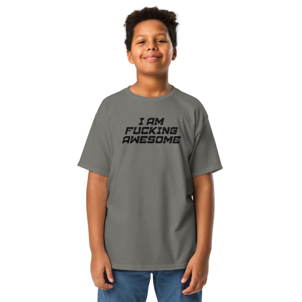 "I Am Fucking Awesome" printed on a charcoal youth classic tee worn by a male