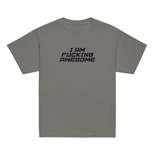 "I Am Fucking Awesome" printed on a charcoal youth classic tee laying on a flat surface