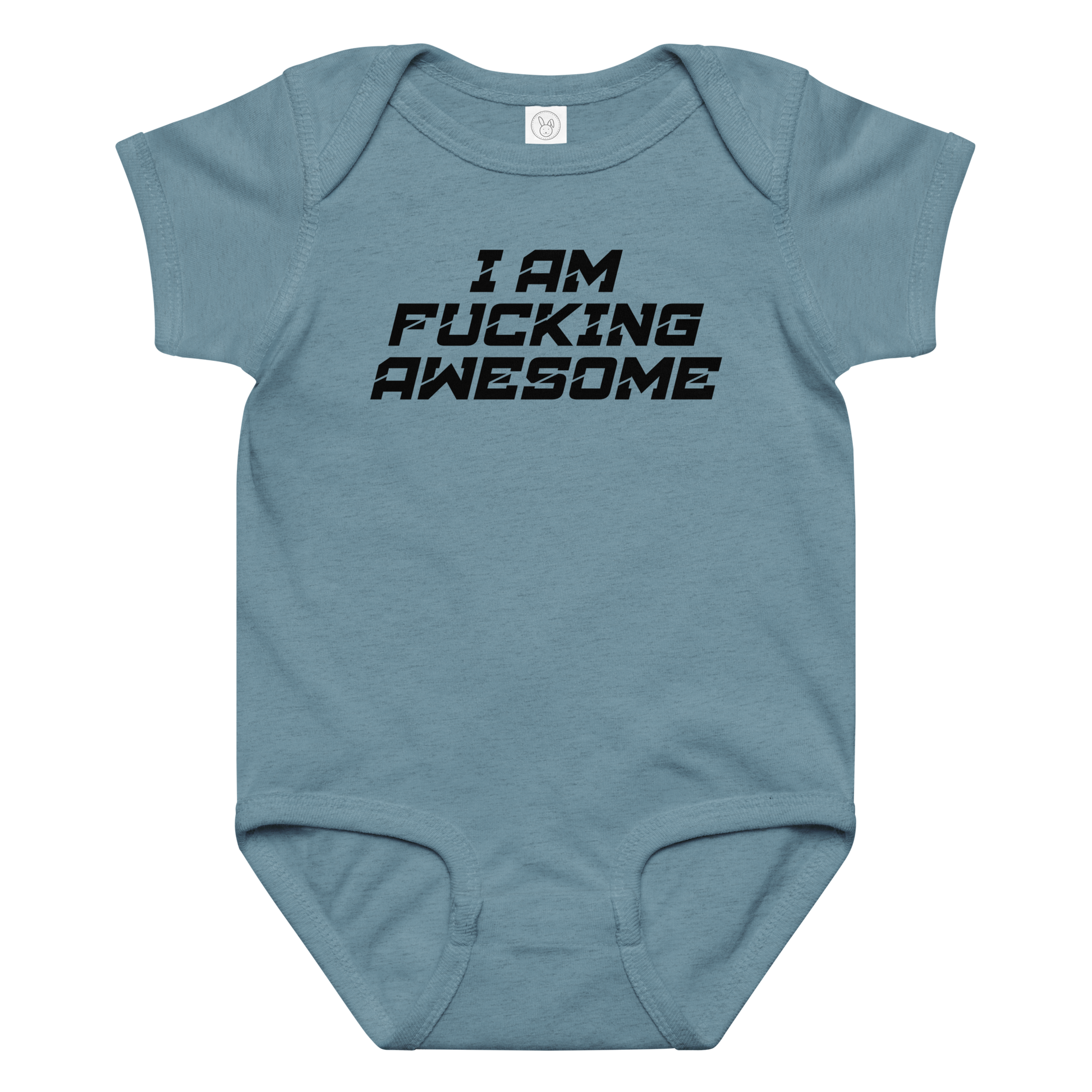 "I Am Fucking Awesome" printed on a vintage indigo baby jersey bodysuit laying on a flat surface amongst other clothes