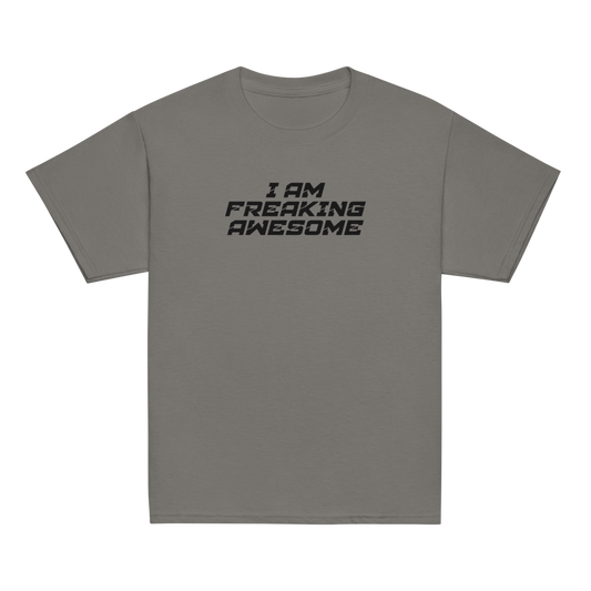 "I Am Freaking Awesome" printed on a charcoal youth classic tee laying on a flat surface
