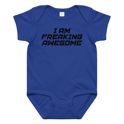 "I Am Freaking Awesome" printed on a royal baby jersey bodysuit laying on a flat surface amongst other clothes