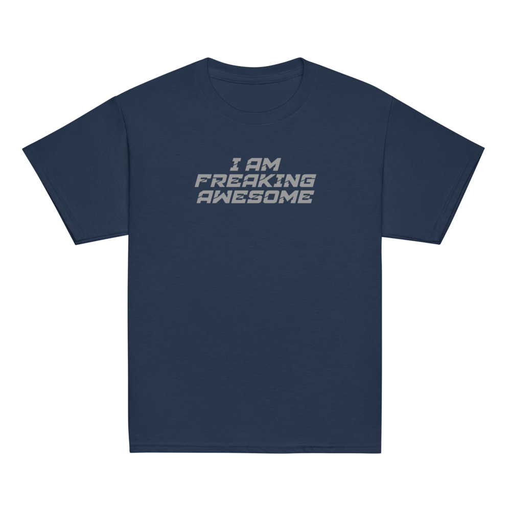 "I Am Freaking Awesome" printed on a navy youth classic tee laying on a flat surface