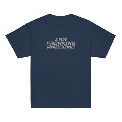 "I Am Freaking Awesome" printed on a navy youth classic tee laying on a flat surface