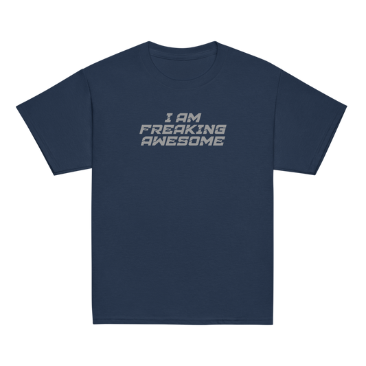 "I Am Freaking Awesome" printed on a navy youth classic tee laying on a flat surface