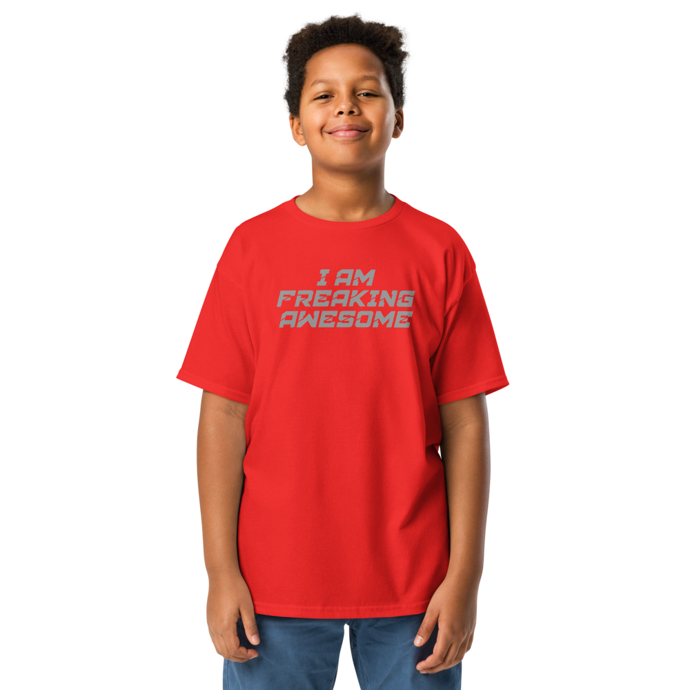 "I Am Freaking Awesome" printed on a red youth classic tee worn by a male