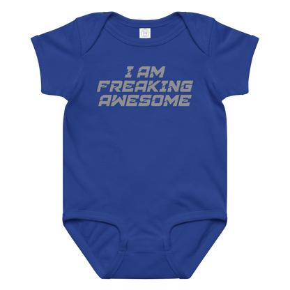 "I Am Freaking Awesome" printed on a royal baby jersey bodysuit laying on a flat surface amongst other clothes