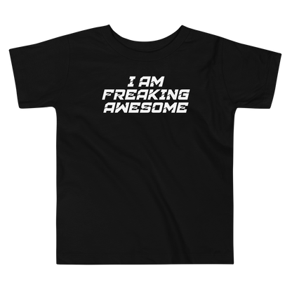 "I Am Freaking Awesome" printed on a black toddler short sleeve tee laying on a flat surface