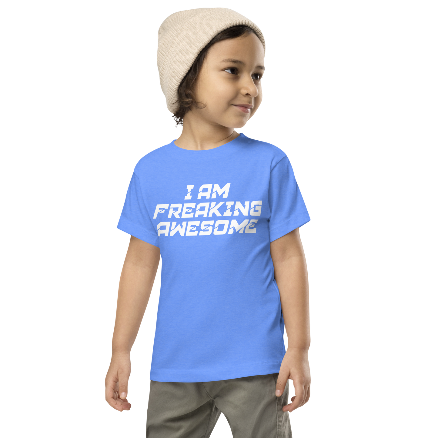 "I Am Freaking Awesome" printed on a heather columbia blue toddler short sleeve tee worn by a male wearing a cap