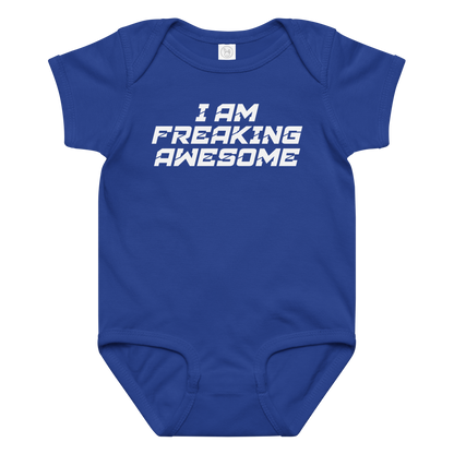 "I Am Freaking Awesome" printed on a royal baby jersey bodysuit laying on a flat surface amongst other clothes