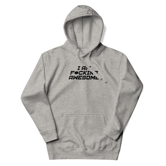 "I Am F*cking Awesome" printed on a carbon grey unisex hoodie laying on a flat surface with the hood up