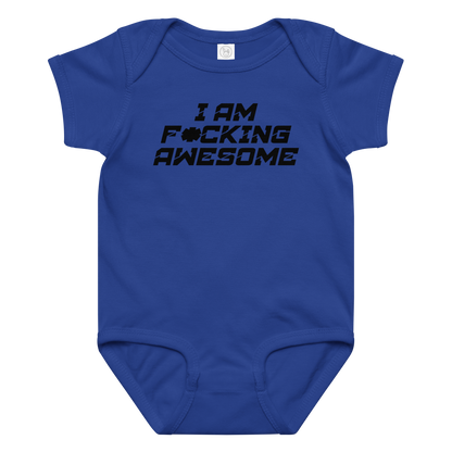 "I Am F*cking Awesome" printed on a royal baby jersey bodysuit laying on a flat surface amongst other clothes
